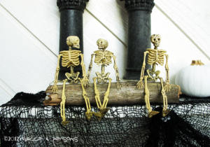 Spooktacular Halloween Mantlescape three skeletons on driftwood